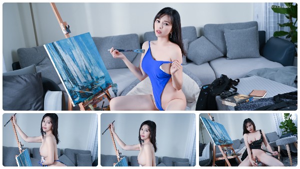 A beautiful woman holding a paintbrush