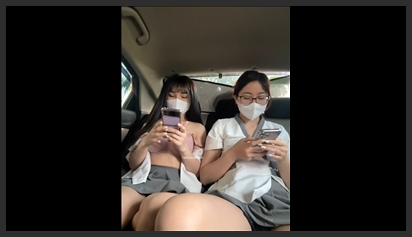 Two girls masturbating while in a taxi