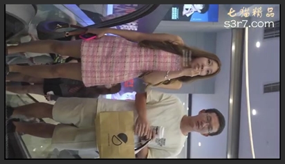 A man secretly films a beautiful woman in a sexy pleated skirt as she bends over, revealing her semi-sheer lace underwear as she stares directly at the camera