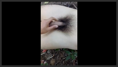 Horny young man with a big cock masturbating on the hill